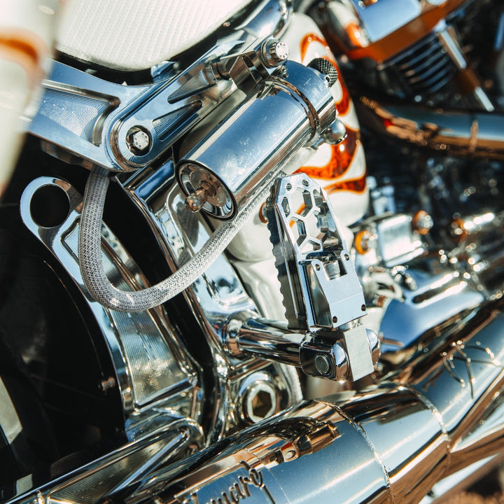 OG HoneyComp V3 Foot Pegs installed on a 2024 Softail Low Rider ST FXLRST