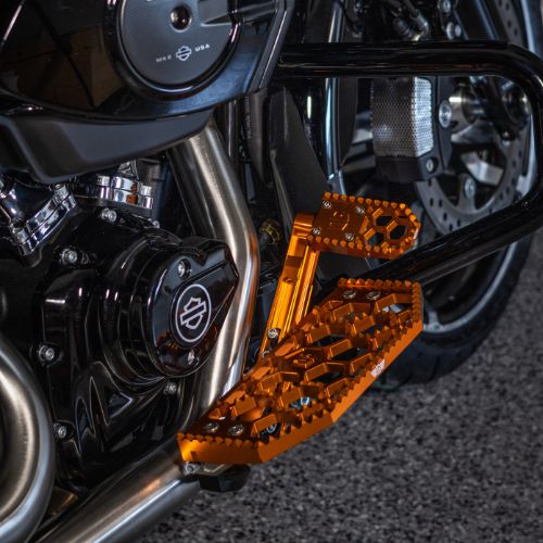 Orange OG HoneyComp V3 Mini Brake Pedal Gripper kit for Adjustable Brake Arm installed on 2024 Road Glide FLTRX